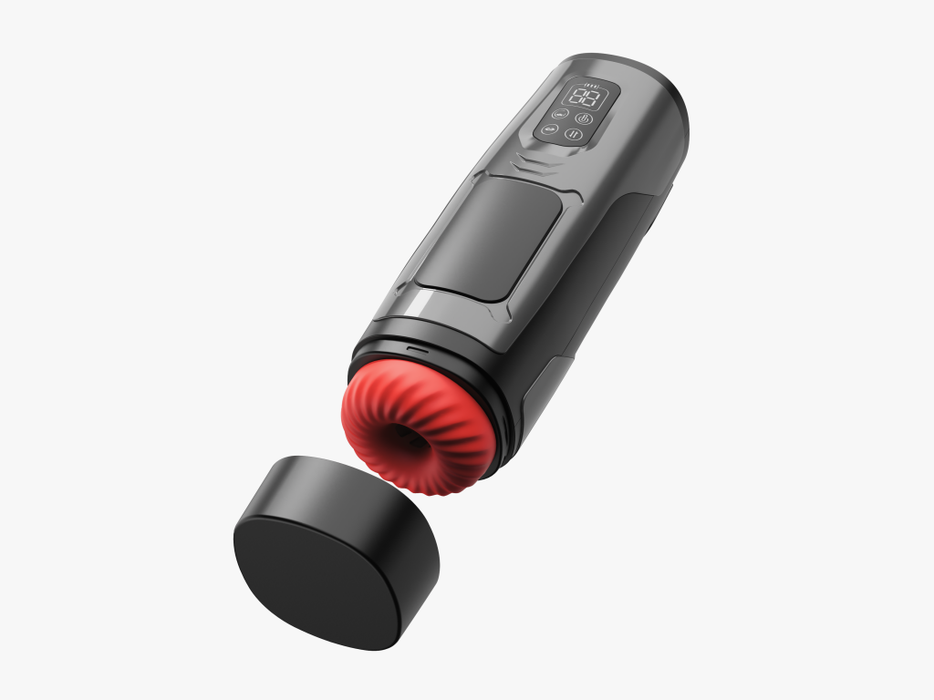 Black and grey heated blowjob masturbator with a bright red donut shaped inner section and the cap laying beside it
